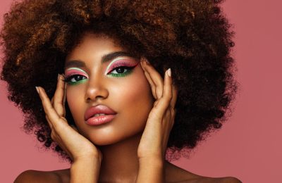 Portrait of young afro woman with bright make-up